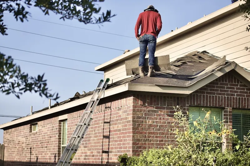Professional roofer working on a residential roof in Diamond Oaks
